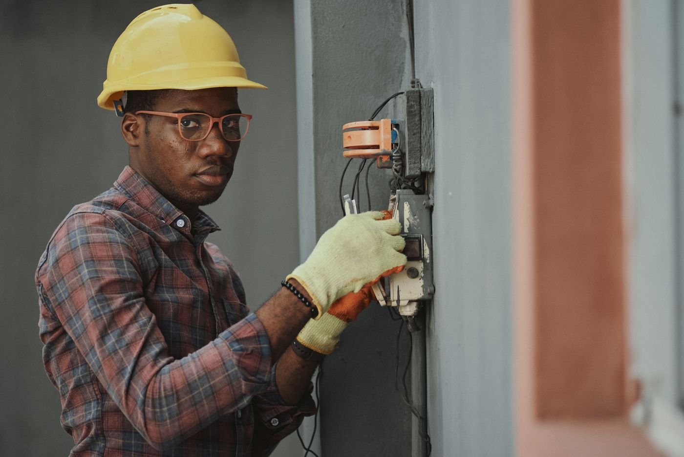 HVAC technician checking a condenser unit